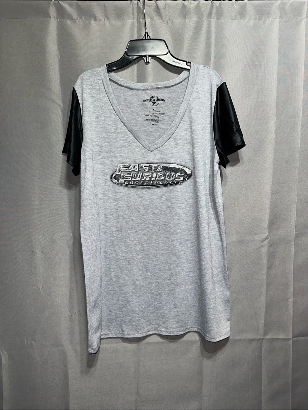Universal Women's Light Gray V-Neck Tee with Black Short Sleeves
